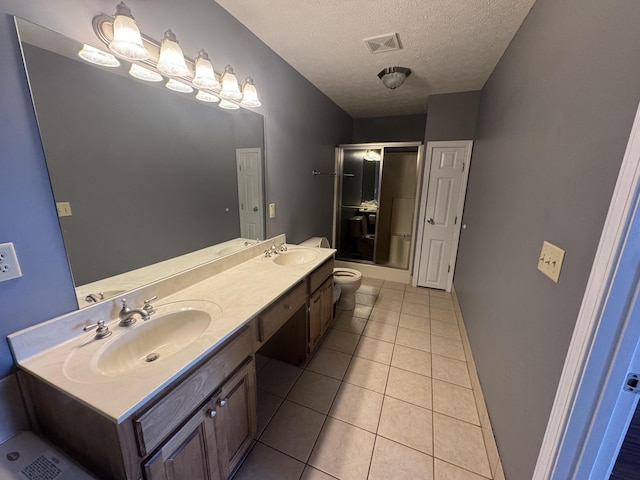 1459 Kit Cowan Rd, Somerset, KY 42501 - bathroom with double vanity, a textured ceiling, tile patterned floors, and combined bath / shower with glass door