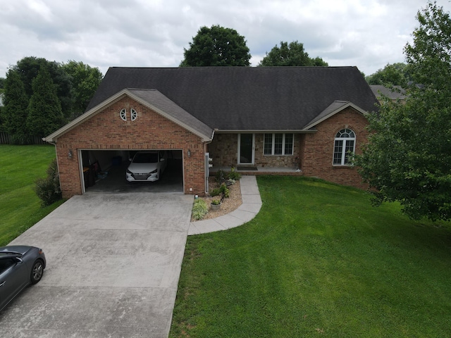 1459 Kit Cowan Rd, Somerset, KY 42501 - view of front of house featuring a garage, driveway, a front lawn, and brick siding