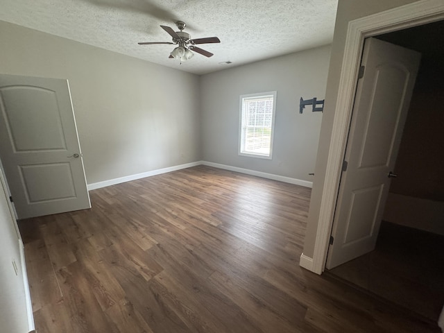 1459 Kit Cowan Rd, Somerset, KY 42501 - unfurnished room with wood finished floors, ceiling fan, and a textured ceiling