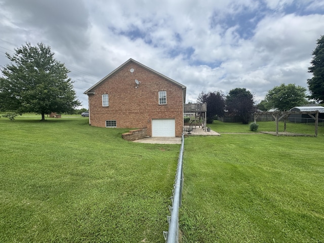 1459 Kit Cowan Rd, Somerset, KY 42501 - view of property exterior featuring an attached garage, brick siding, driveway, a deck, and a patio