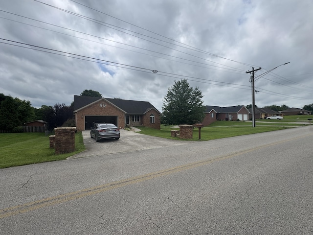 1459 Kit Cowan Rd, Somerset, KY 42501 - view of front of house featuring driveway, an attached garage, a front lawn, and brick siding