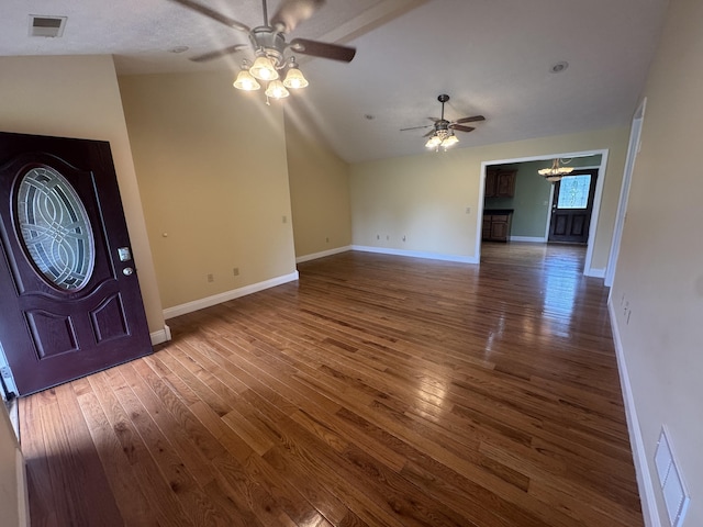1459 Kit Cowan Rd, Somerset, KY 42501 - unfurnished living room featuring a ceiling fan, wood finished floors, a chandelier, and vaulted ceiling