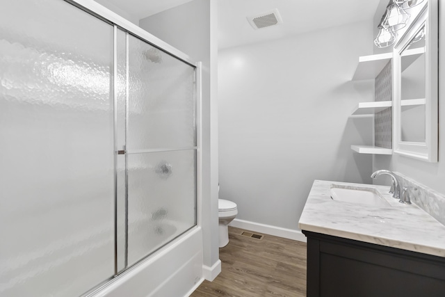 168 Kentucky Ln, Pine Knot, KY 42635 - full bath with vanity, bath / shower combo with glass door, and wood finished floors