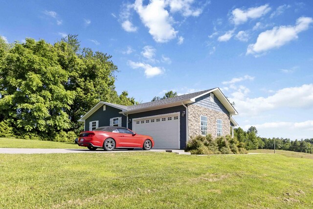168 Kentucky Ln, Pine Knot, KY 42635 - view of property exterior with a garage, stone siding, a yard, and driveway