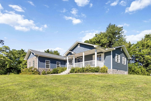 168 Kentucky Ln, Pine Knot, KY 42635 - view of front of house featuring a porch, a front lawn, and stone siding