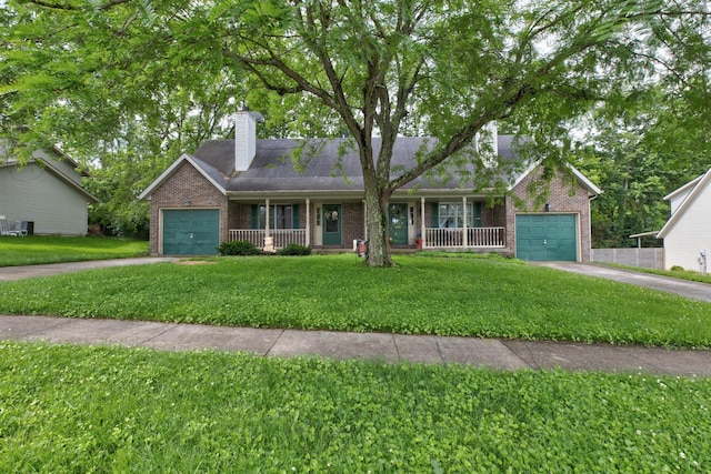 109 Quail Ridge Rd, Winchester, KY 40391 - ranch-style home featuring a garage, concrete driveway, covered porch, and brick siding