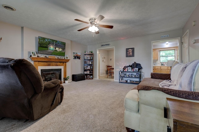 109 Quail Ridge Rd, Winchester, KY 40391 - carpeted living area with ceiling fan, a fireplace, and a textured ceiling