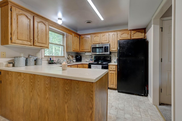 109 Quail Ridge Rd, Winchester, KY 40391 - kitchen featuring black appliances, a peninsula, light countertops, and stone finish floors