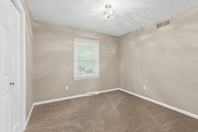 3848 Mcgarry Dr, Lexington, KY 40514 - carpeted spare room featuring a textured ceiling and a chandelier