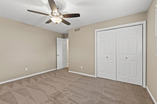3848 Mcgarry Dr, Lexington, KY 40514 - unfurnished bedroom with carpet flooring, a closet, a ceiling fan, and a textured ceiling