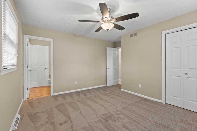 3848 Mcgarry Dr, Lexington, KY 40514 - unfurnished bedroom with carpet flooring, a textured ceiling, a closet, and ceiling fan