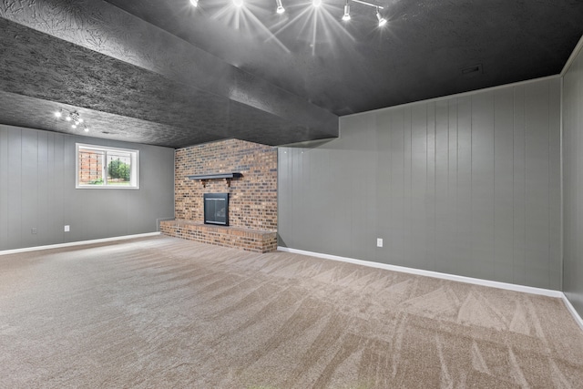 3848 Mcgarry Dr, Lexington, KY 40514 - unfurnished living room featuring track lighting, carpet floors, a brick fireplace, and wood walls