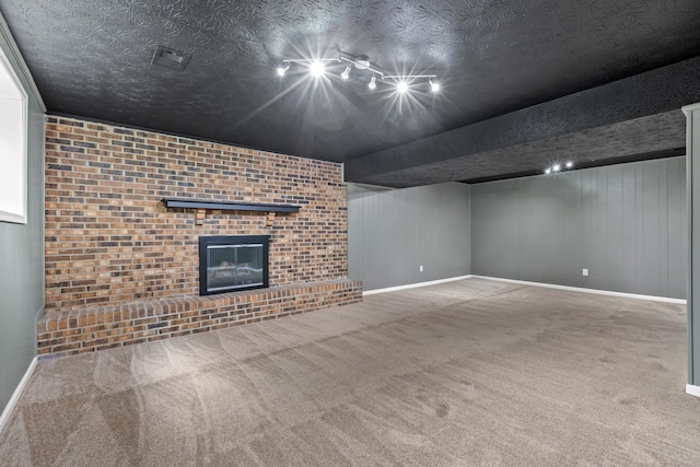 3848 Mcgarry Dr, Lexington, KY 40514 - unfurnished living room featuring carpet, a brick fireplace, and track lighting