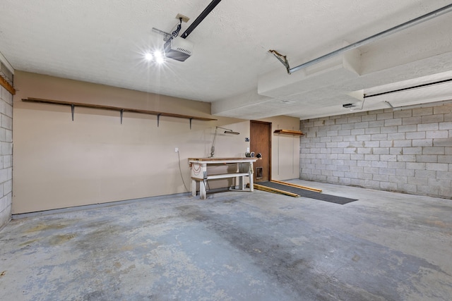 3848 Mcgarry Dr, Lexington, KY 40514 - garage featuring a workshop area, a garage door opener, and concrete block wall