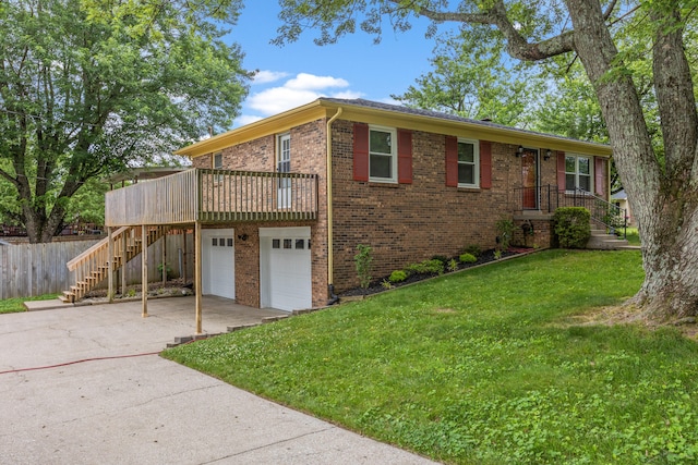 3848 Mcgarry Dr, Lexington, KY 40514 - view of home's exterior with stairway, brick siding, a garage, driveway, and a wooden deck