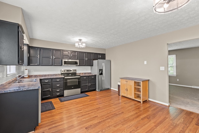 3848 Mcgarry Dr, Lexington, KY 40514 - kitchen with stainless steel appliances, a textured ceiling, light wood-type flooring, plenty of natural light, and tasteful backsplash