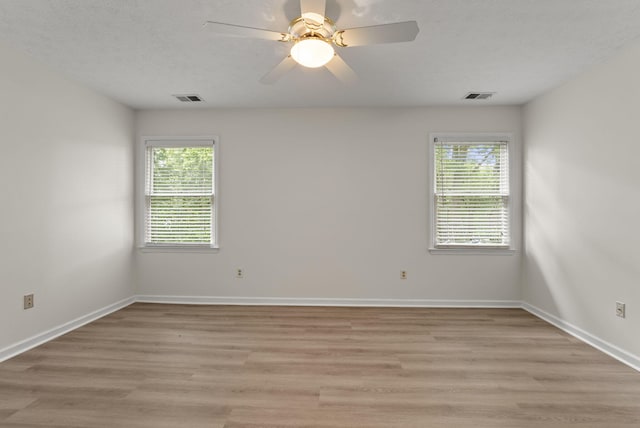 1048 Vero Ct, Lexington, KY 40509 - empty room featuring plenty of natural light, light wood-style flooring, and a ceiling fan