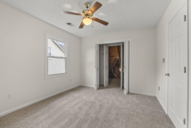 1048 Vero Ct, Lexington, KY 40509 - unfurnished bedroom featuring carpet floors, a ceiling fan, and a textured ceiling