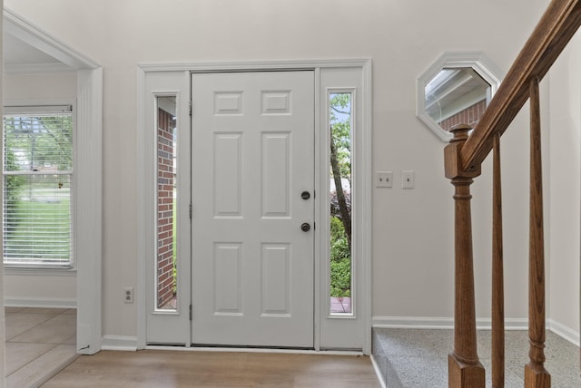 1048 Vero Ct, Lexington, KY 40509 - foyer entrance with plenty of natural light, ornamental molding, and stairs
