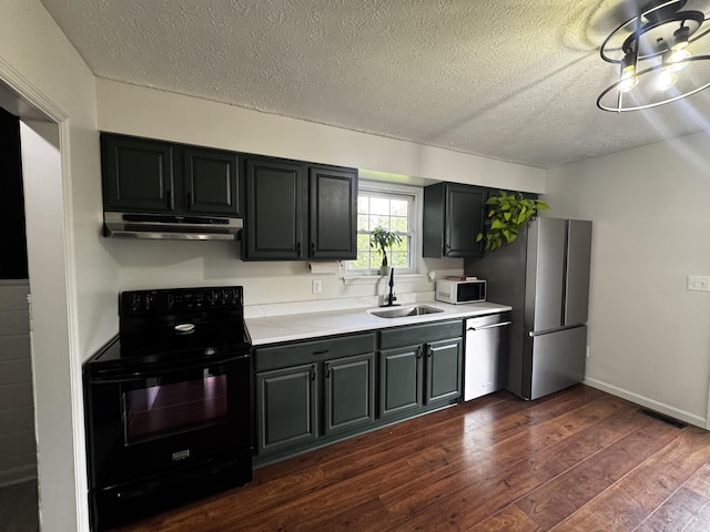 109 Creekstone Ct, Frankfort, KY 40601 - kitchen with appliances with stainless steel finishes, under cabinet range hood, light countertops, dark wood-style floors, and a textured ceiling