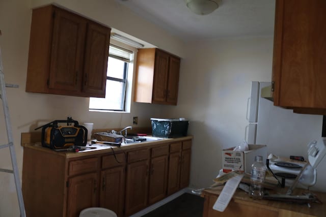 382 W Main St, Carlisle, KY 40311 - kitchen with brown cabinetry and light countertops