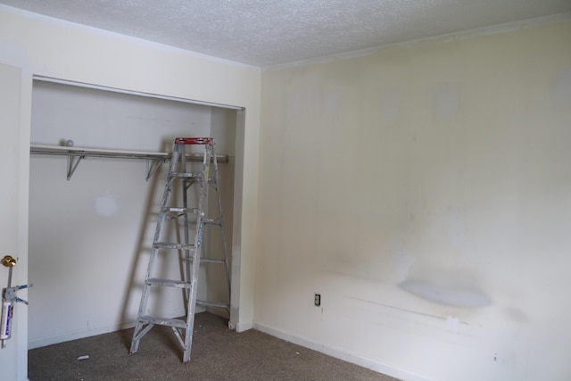 382 W Main St, Carlisle, KY 40311 - unfurnished bedroom with carpet flooring, a textured ceiling, and a closet