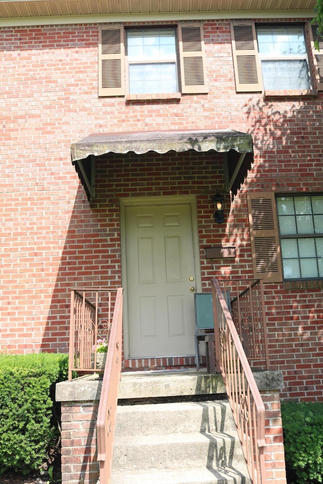 382 W Main St, Carlisle, KY 40311 - property entrance with brick siding