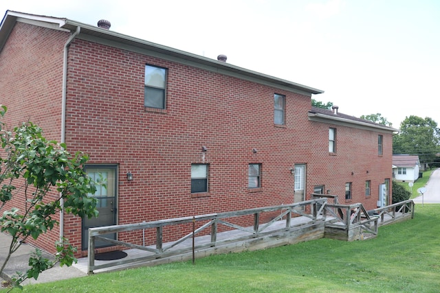 382 W Main St, Carlisle, KY 40311 - back of house with brick siding and a yard
