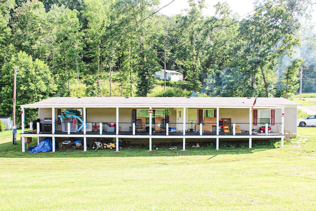 610 Freeman Branch Rd, East Bernstadt, KY 40729 - back of property with a yard and a porch