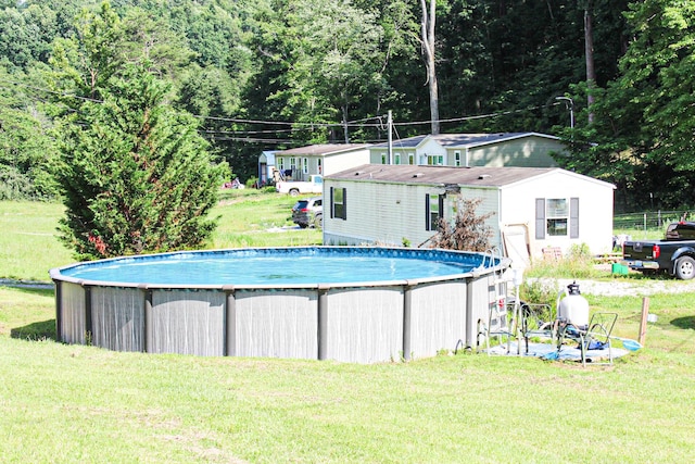 610 Freeman Branch Rd, East Bernstadt, KY 40729 - outdoor pool featuring a lawn and a wooded view