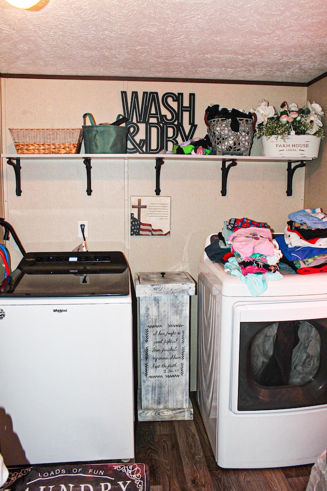 610 Freeman Branch Rd, East Bernstadt, KY 40729 - laundry room featuring washer and clothes dryer, a textured ceiling, dark wood-style floors, and ornamental molding