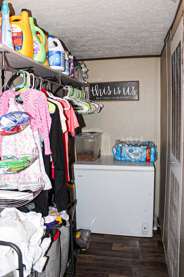 610 Freeman Branch Rd, East Bernstadt, KY 40729 - walk in closet featuring wood finished floors