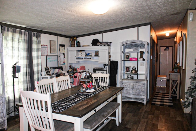 610 Freeman Branch Rd, East Bernstadt, KY 40729 - dining space with a textured ceiling and dark wood-style flooring