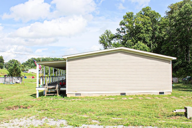 610 Freeman Branch Rd, East Bernstadt, KY 40729 - view of home's exterior with crawl space and a yard