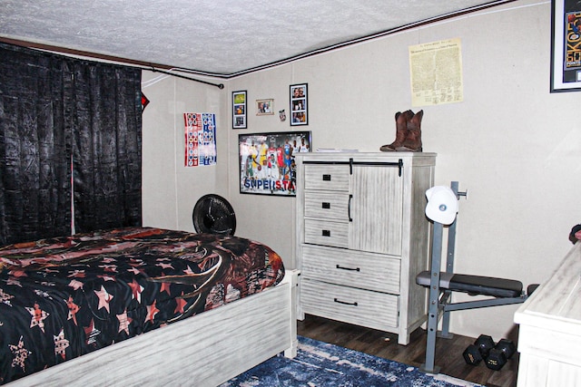 610 Freeman Branch Rd, East Bernstadt, KY 40729 - bedroom featuring dark wood-style floors and a textured ceiling