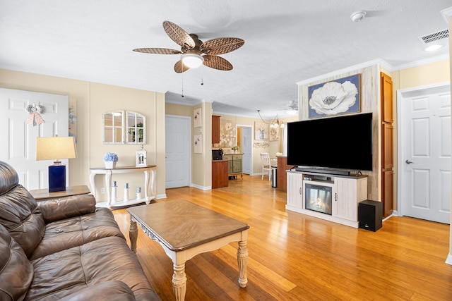1809 Pine Top Rd, London, KY 40741 - living area featuring ceiling fan, light wood-style flooring, and ornamental molding