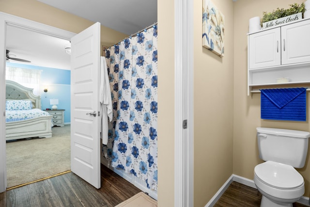 1809 Pine Top Rd, London, KY 40741 - ensuite bathroom with wood finished floors, a shower with shower curtain, and ceiling fan