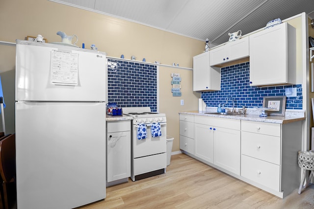 1809 Pine Top Rd, London, KY 40741 - kitchen featuring white appliances, backsplash, light wood finished floors, white cabinetry, and ornamental molding