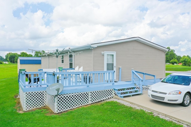 1809 Pine Top Rd, London, KY 40741 - back of property with a yard, a deck, and a storage shed