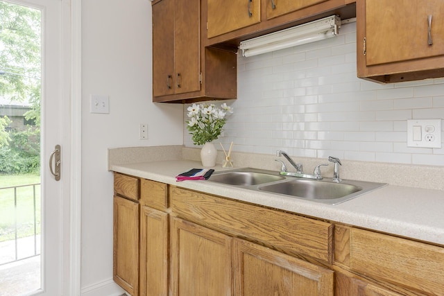139 Tartan Dr, Lexington, KY 40517 - kitchen featuring light countertops, tasteful backsplash, and brown cabinets