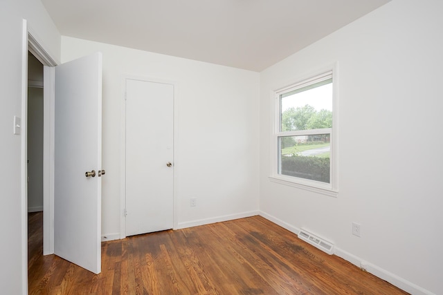 139 Tartan Dr, Lexington, KY 40517 - unfurnished bedroom with wood finished floors and baseboards