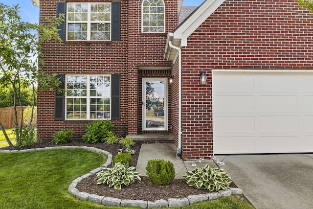 3072 Majestic View Walk, Lexington, KY 40511 - view of exterior entry with an attached garage, brick siding, and driveway