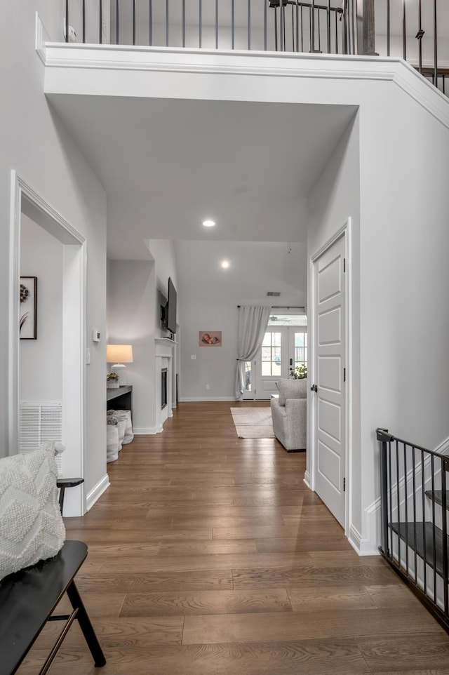 1912 Tidewater Flt, Lexington, KY 40509 - unfurnished living room featuring wood finished floors, recessed lighting, stairs, and a fireplace