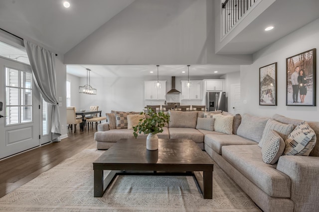 1912 Tidewater Flt, Lexington, KY 40509 - living area featuring wood finished floors, high vaulted ceiling, recessed lighting, and a chandelier