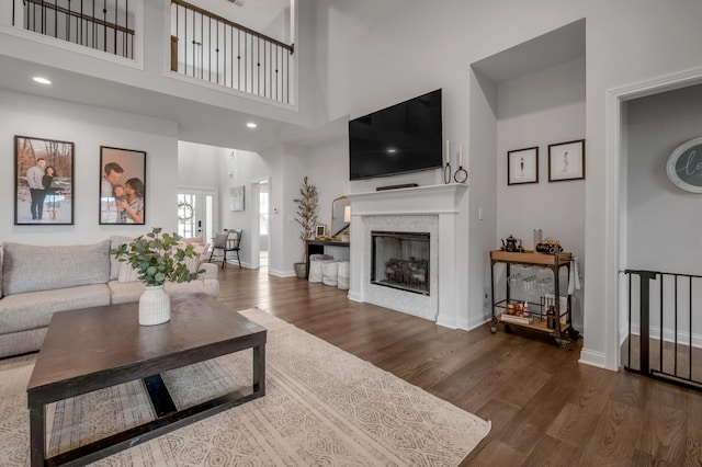 1912 Tidewater Flt, Lexington, KY 40509 - living area with wood finished floors, a towering ceiling, a fireplace, and recessed lighting
