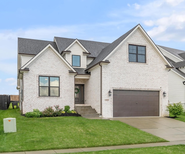 1912 Tidewater Flt, Lexington, KY 40509 - view of front of home featuring a garage, a front lawn, roof with shingles, and concrete driveway