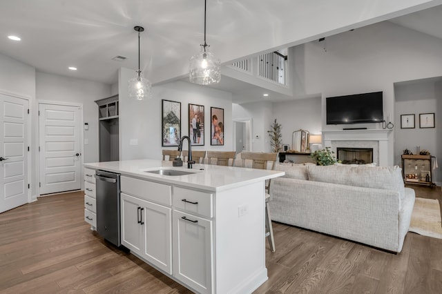 1912 Tidewater Flt, Lexington, KY 40509 - kitchen featuring dishwasher, dark wood-style flooring, a fireplace, light countertops, and recessed lighting