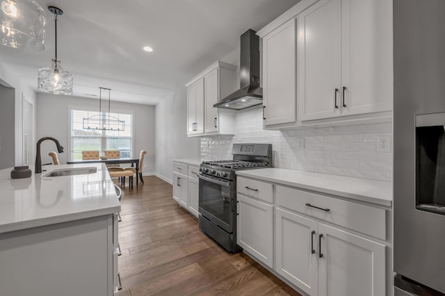 1912 Tidewater Flt, Lexington, KY 40509 - kitchen with black gas range oven, wall chimney exhaust hood, dark wood-style floors, backsplash, and pendant lighting