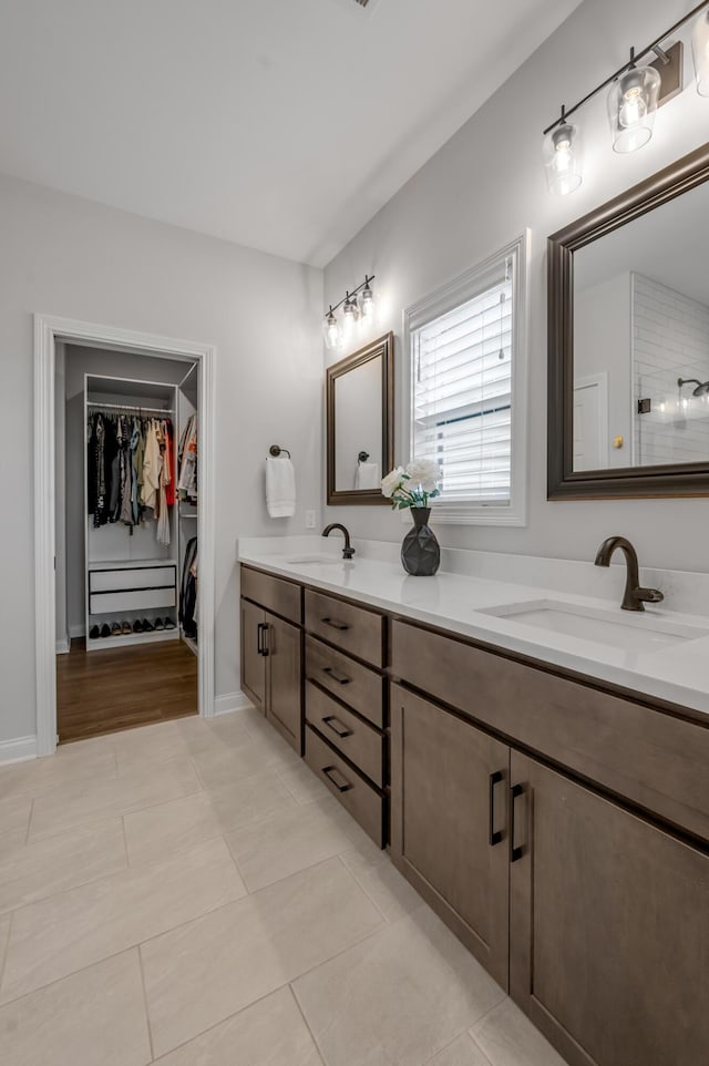 1912 Tidewater Flt, Lexington, KY 40509 - full bathroom with double vanity, a spacious closet, tile patterned flooring, and a shower