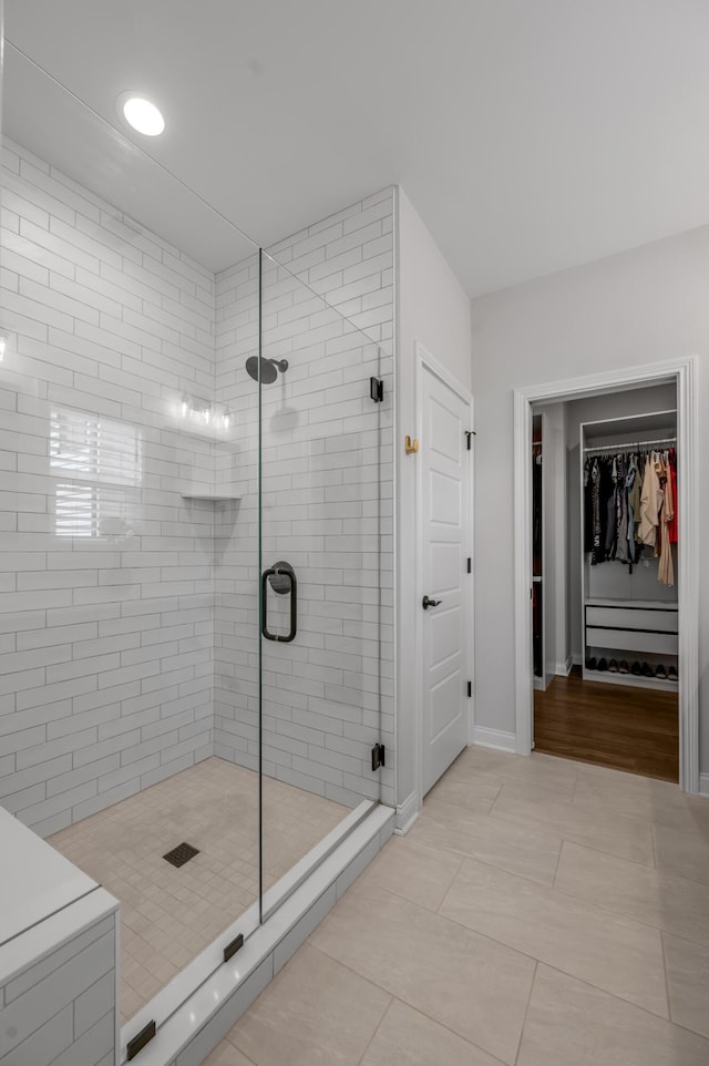 1912 Tidewater Flt, Lexington, KY 40509 - bathroom with a stall shower, a spacious closet, and tile patterned flooring